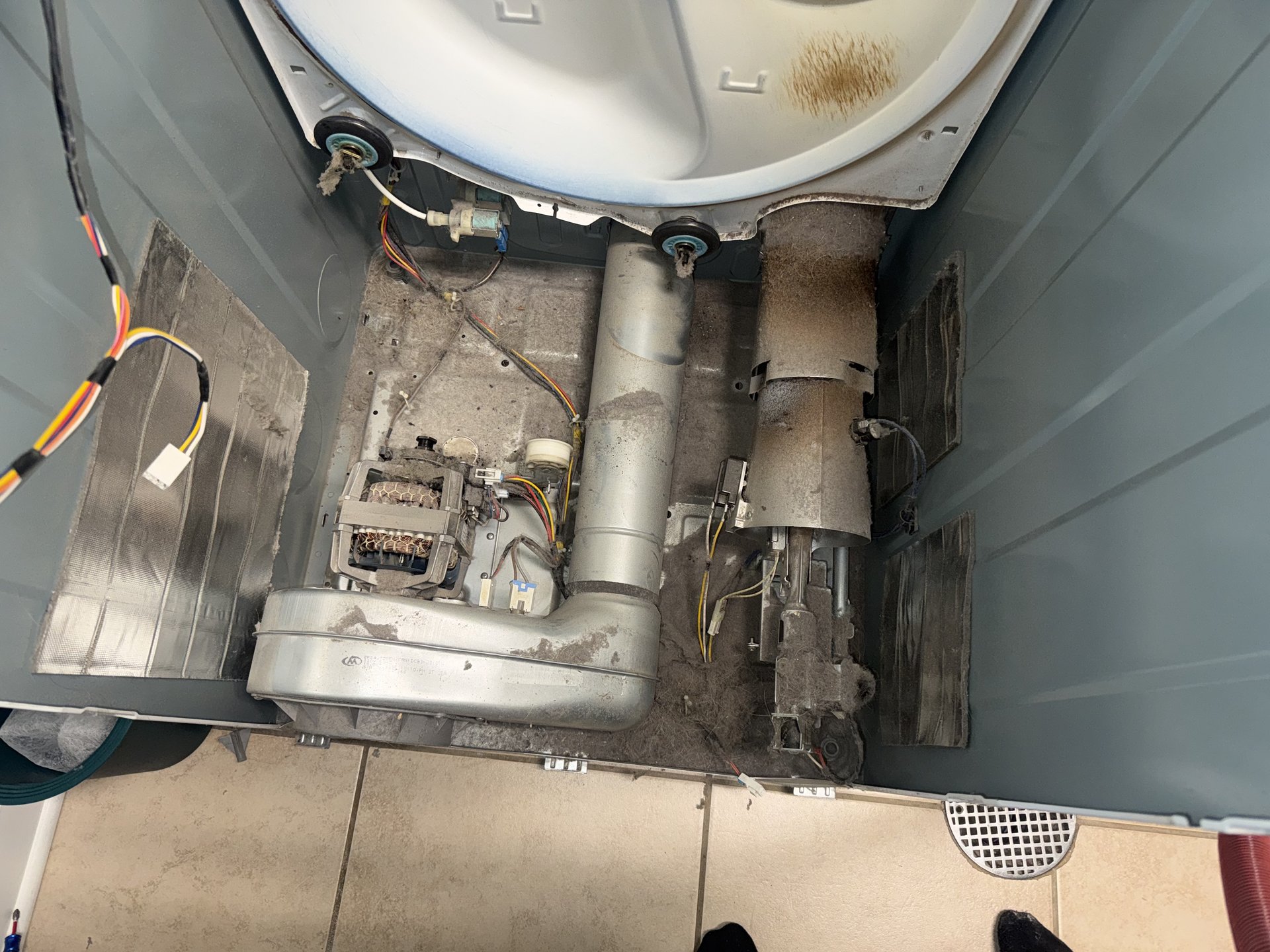 Dryer heating element and blower housing coated with lint before Family Touch dryer cleaning